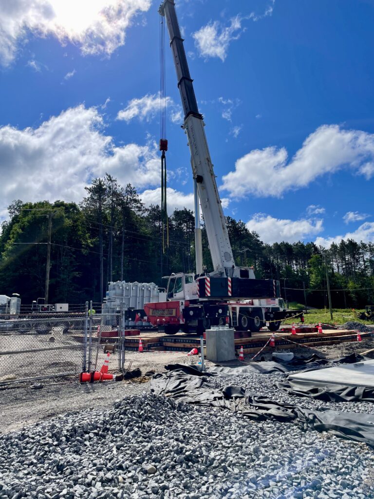 Contractor using World Forest Group Eucalyptus timber mats for ground protection under heavy crane. Transmission substation.